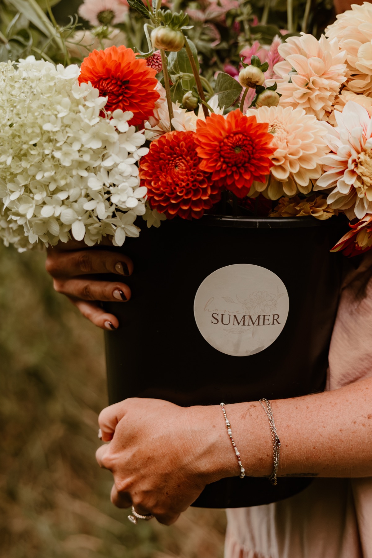 A bucket of freshly gathered seasonal flowers