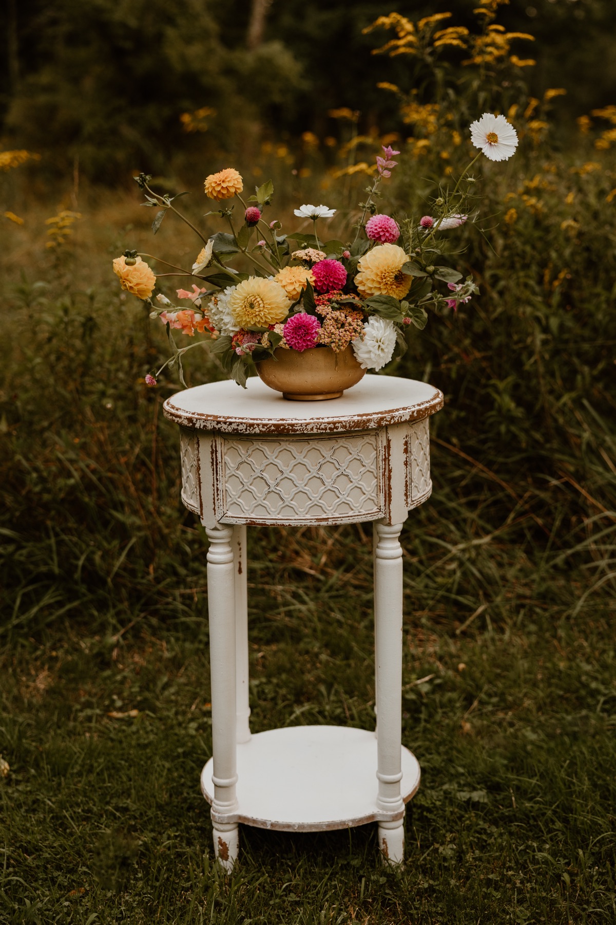 A garden-style arrangement of dahlias and other blooms